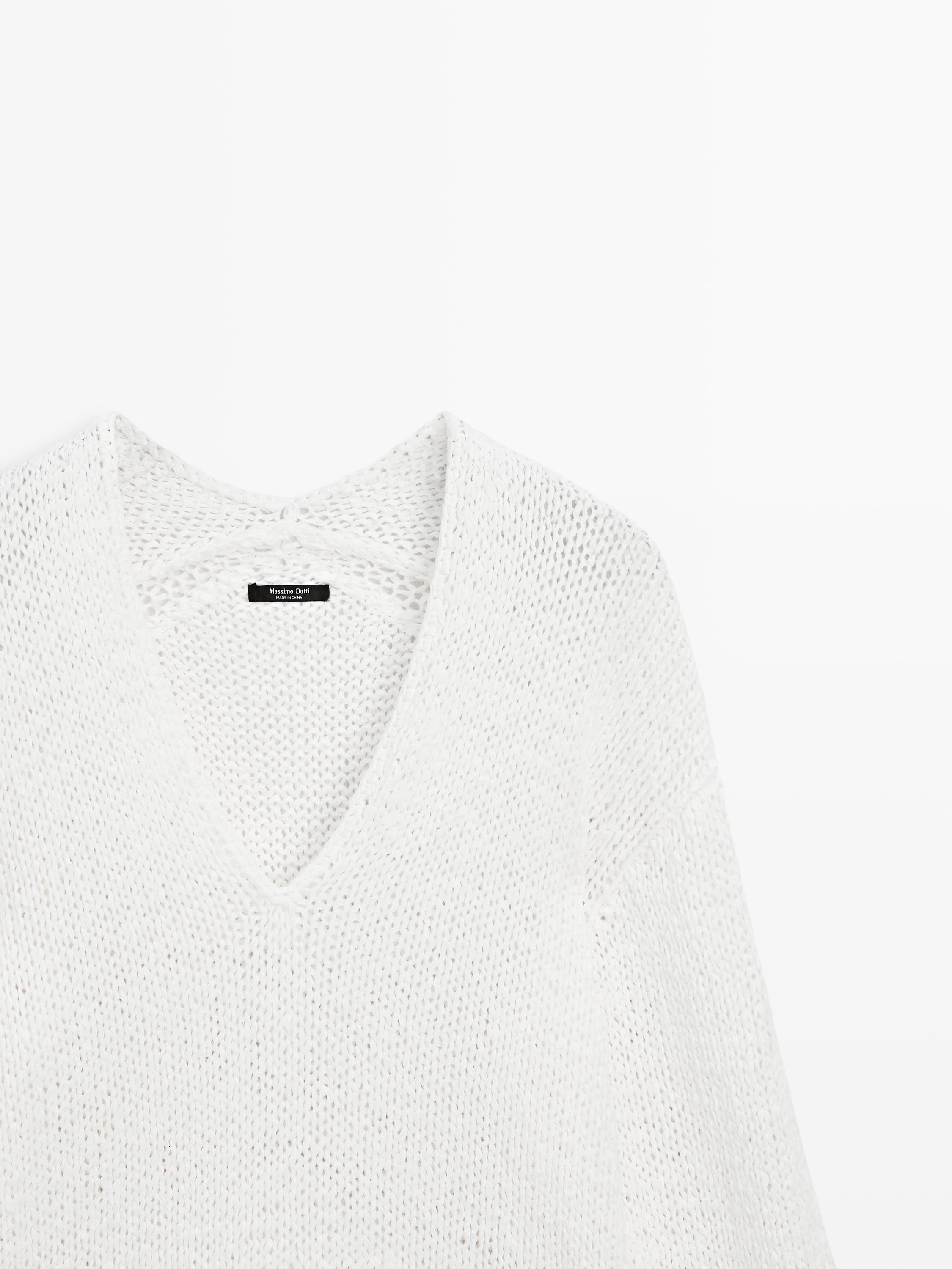 Pull en maille ajourée à col V